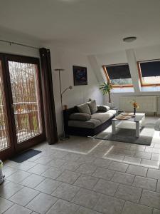 a living room with a couch and a table at R&A Lambertz in Düsseldorf