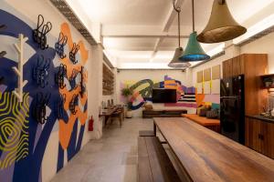 a living room with a table and a couch at M Boutique Hostel Legian in Legian