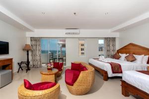 Ein Bett oder Betten in einem Zimmer der Unterkunft Aristocrat Residence & Hotel