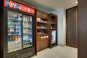 a cocacola soda refrigerator in a store at Holiday Inn Express & Suites - Elizabethtown North by IHG in Elizabethtown