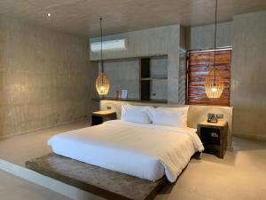 Rúm í herbergi á Cebu R Resort Tabuelan