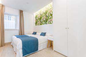 Łóżko lub łóżka w pokoju w obiekcie Espectacular casa de 6 dormitorios, 7 banos y 2 terrazas