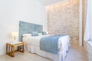 Łóżko lub łóżka w pokoju w obiekcie Espectacular casa de 6 dormitorios, 7 banos y 2 terrazas