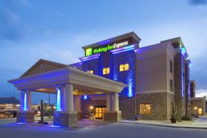 a hotel with blue lights in front of a building at Holiday Inn Express & Suites Truth Or Consequences, an IHG Hotel in Truth or Consequences