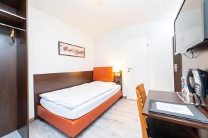 Postel nebo postele na pokoji v ubytování Hotel Rheinfelderhof