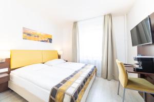 Postel nebo postele na pokoji v ubytování Hotel Rheinfelderhof