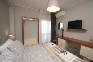 Televízia a/alebo spoločenská miestnosť v ubytovaní B&B Capuam Vetere Accommodation