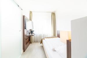 Postel nebo postele na pokoji v ubytování Hotel Rheinfelderhof