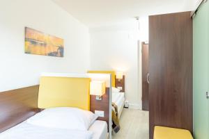 Postel nebo postele na pokoji v ubytování Hotel Rheinfelderhof