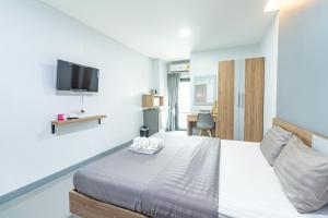Postel nebo postele na pokoji v ubytování Be Wish Residence
