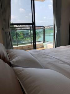 Postel nebo postele na pokoji v ubytování 單眼皮民宿 Single Eyelid Hostel