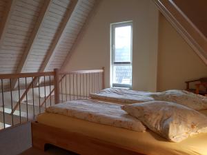 เตียงในห้องที่ Haus Rüm Hart