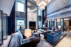 a living room with a couch and a fireplace at Crowne Plaza Baoji City Center by IHG in Baoji