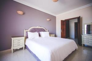 
سرير أو أسرّة في غرفة في Appart Hotel Alia
