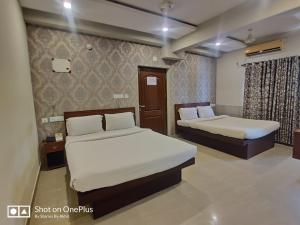 Cama o camas de una habitación en Sreepathi Indraprastha