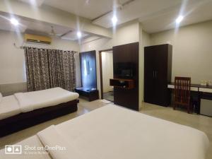 Cama o camas de una habitación en Sreepathi Indraprastha