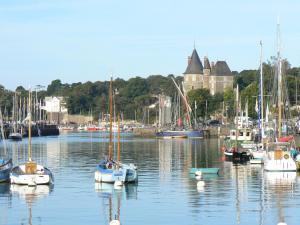 a bunch of boats are docked in a harbor at Maison proche Golf plage et piscine à Pornic in Pornic