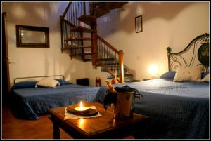 A bed or beds in a room at Pedra Residence