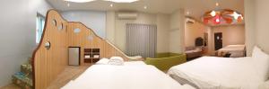 Happiness Yes Inn 객실 침대