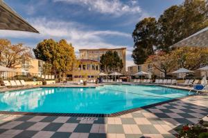 a large swimming pool in front of a building at Crowne Plaza Cabana Hotel by IHG in Palo Alto