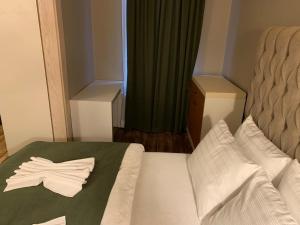 Postel nebo postele na pokoji v ubytování Berfinn Hotel Beşiktaş