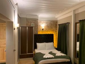 Postel nebo postele na pokoji v ubytování Berfinn Hotel Beşiktaş