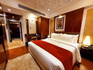 Voodi või voodid majutusasutuse Hotel MBC Citadel Nashik toas