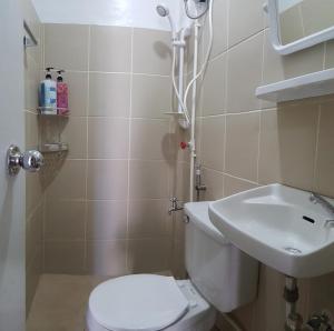 a bathroom with a toilet and a sink at 3BU Hostel Baguio - Session-Governor Pack in Baguio