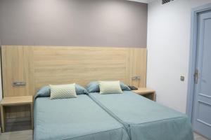 Posteľ alebo postele v izbe v ubytovaní Ramblas Hotel