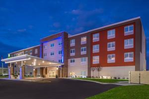 a rendering of the front of a hotel at night at Holiday Inn Express Melbourne West, an IHG Hotel in Melbourne