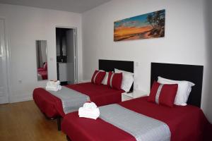 Ένα ή περισσότερα κρεβάτια σε δωμάτιο στο Guest House Henrique VIII