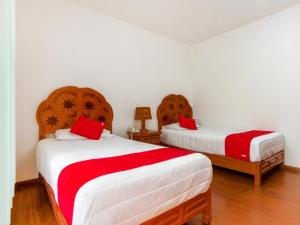Kama o mga kama sa kuwarto sa OYO Hotel Montes, Atlixco Puebla