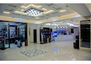 a large room with a store with a lot of shops at Parliament Palace Hotel in Khujand