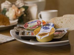 a plate with different types of food on a table at Il Soffione Home in Salerno