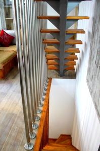 a staircase in a room with wood and metal railings at EVANNA HOUSE in Symi
