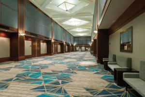 a hallway of a building with a carpet with stars on it at Crowne Plaza Springfield Convention Center, an IHG Hotel in Springfield