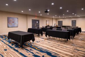 a conference room with tables and chairs in it at Holiday Inn Express & Suites Alamogordo Highway 54/70 by IHG in Alamogordo +51 photos