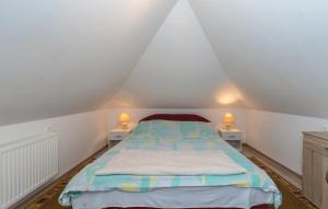 A bed or beds in a room at Ruralna kuća za odmor Ružica