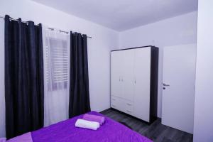 Postel nebo postele na pokoji v ubytování Apartments Samac