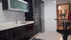 A kitchen or kitchenette at Varosha Combarro Még 25 kép