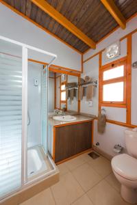 a bathroom with a shower and a sink and a toilet at Fade Hotel by La Hacienda Ras Sudr in Ras Matarma