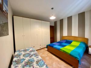 מיטה או מיטות בחדר ב-Casa Fer La Morra