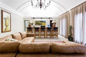 a living room with a couch and a dining room at The Gregory in Pinetown