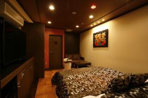 Una cama o camas en una habitación de Hotel Pasion Resort (Adult Only)