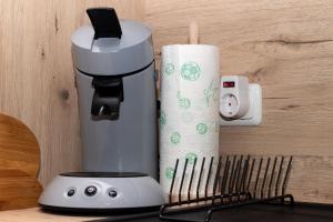 Příslušenství pro přípravu čaje a kávy v ubytování BIT-City Studio und Appartement