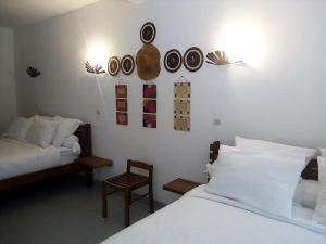 Postel nebo postele na pokoji v ubytování SATRANA HOTEL TAMATAVE