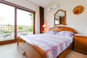 Cama o camas de una habitación en Rooms & Apartments Hegic