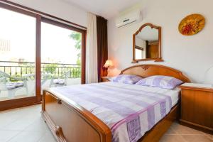 Postel nebo postele na pokoji v ubytování Rooms & Apartments Hegic