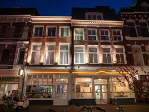 a building on a city street at night at Hotel Hague Center in The Hague