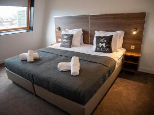 Postel nebo postele na pokoji v ubytování Hotel Hague Center